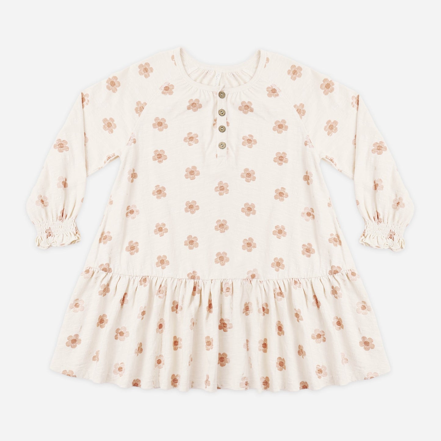 Girl wearing the Pink Daisies Swing Dress with long sleeves and button snaps
