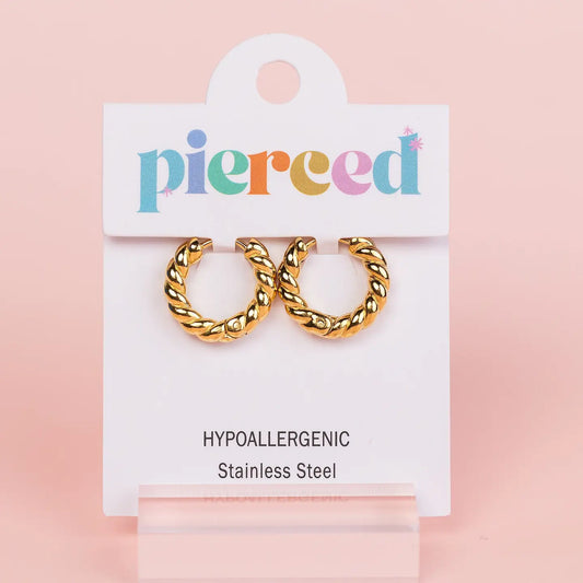Gold hoop earrings on a 'pierceed' branded card 