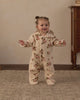 Baby wearing the hooded rose garden fleece jumpsuit