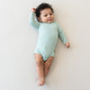 Sage Long Sleeve Bodysuit - Kyte Baby, on model
