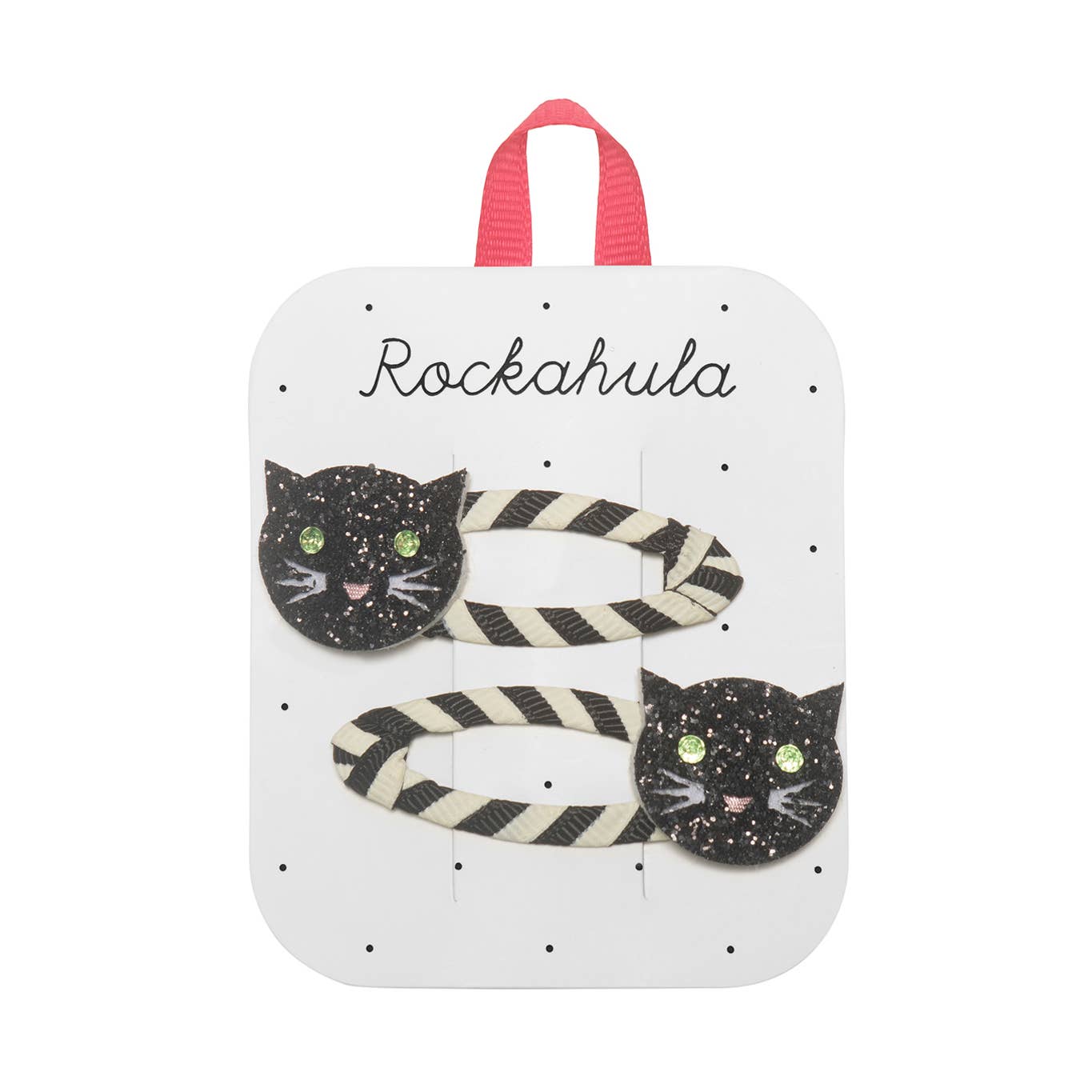 Two black and white striped hair clips with glittery black cat face charms, displayed on a white card with the name 'Rockahula' and a pink hanging loop.