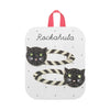 Two black and white striped hair clips with glittery black cat face charms, displayed on a white card with the name 'Rockahula' and a pink hanging loop.