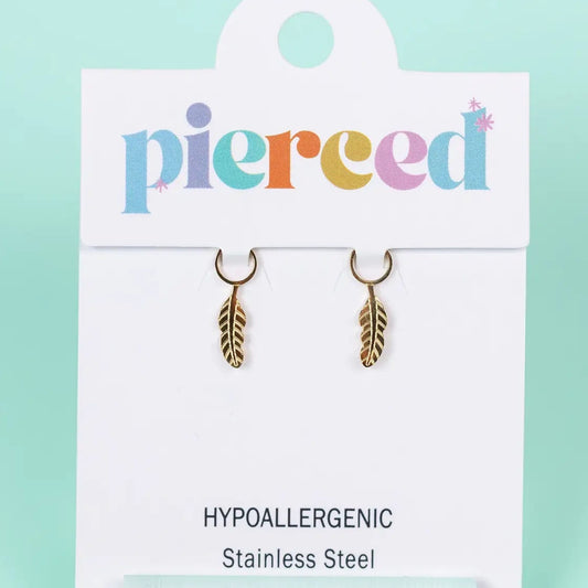 Gold feather earrings on a 'pierced' branded card with a light blue background