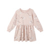 Pink dress with poodle dog pattern on a white background