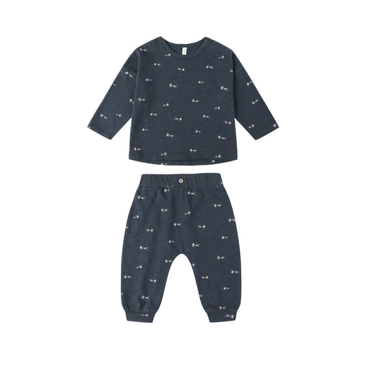 Navy blue children's lounge set with small white patterns on a white background