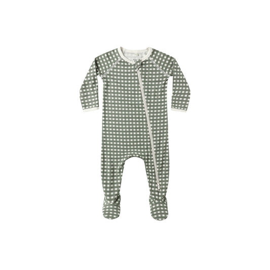 Green polka dot baby onesie on a white background