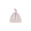 Pink baby hat with a knot on top against a white background