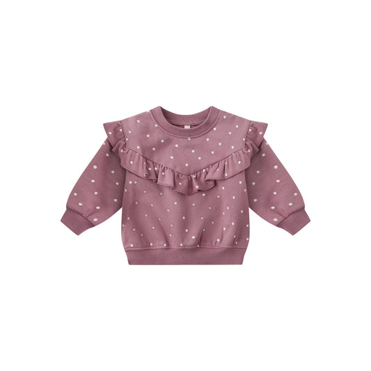 Pink sweatshirt with ruffled details on a white background