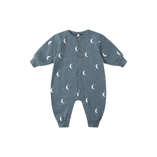 Blue baby onesie with moon pattern on a white background
