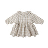 Checkered dress with long sleeves on a white background
