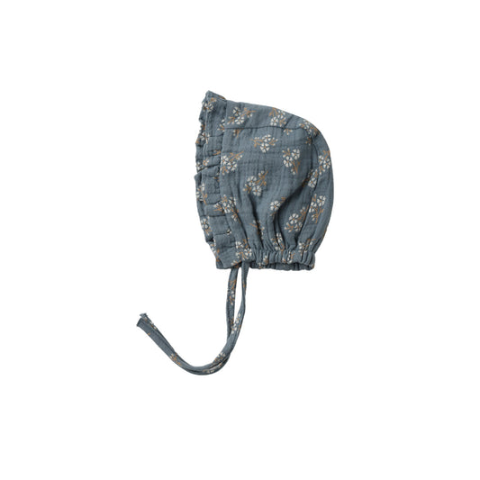 Blue floral baby bonnet on a white background