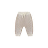 Striped baby pants with a bow on a white background