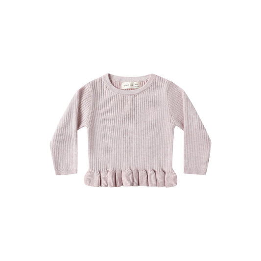 Pink ribbed sweater with ruffled hem on a white background