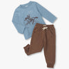 Blue long-sleeve shirt with horse graphic and brown pants on a white background