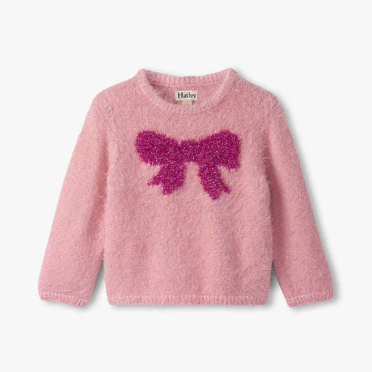 Pink sweater with a large purple bow on a white background