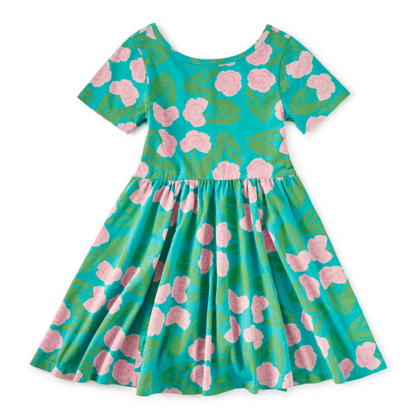 Floral dress with pink flowers on a teal background