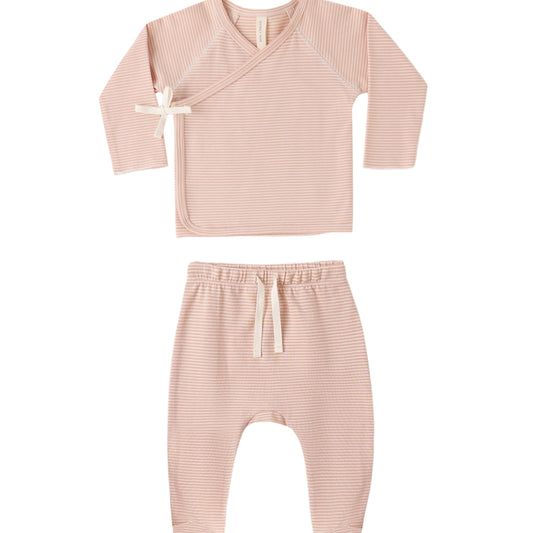 Pink baby outfit with long-sleeve top and pants on a white background