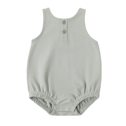 Light gray baby romper with button details on a white background