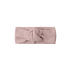 Pink headband with a knot on a white background