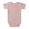 Pink baby bodysuit with short sleeves on a white background