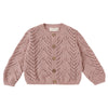 Pink knitted cardigan with button details on a white background