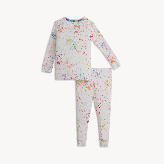 Children's pajama set with colorful splatter pattern on a white background