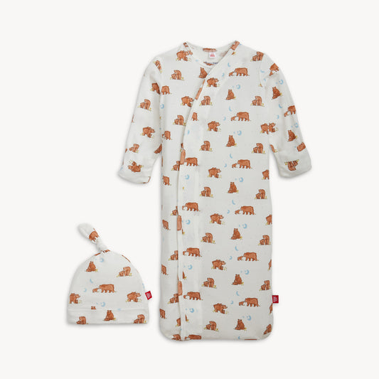 Baby onesie with bear pattern and matching hat on a white background