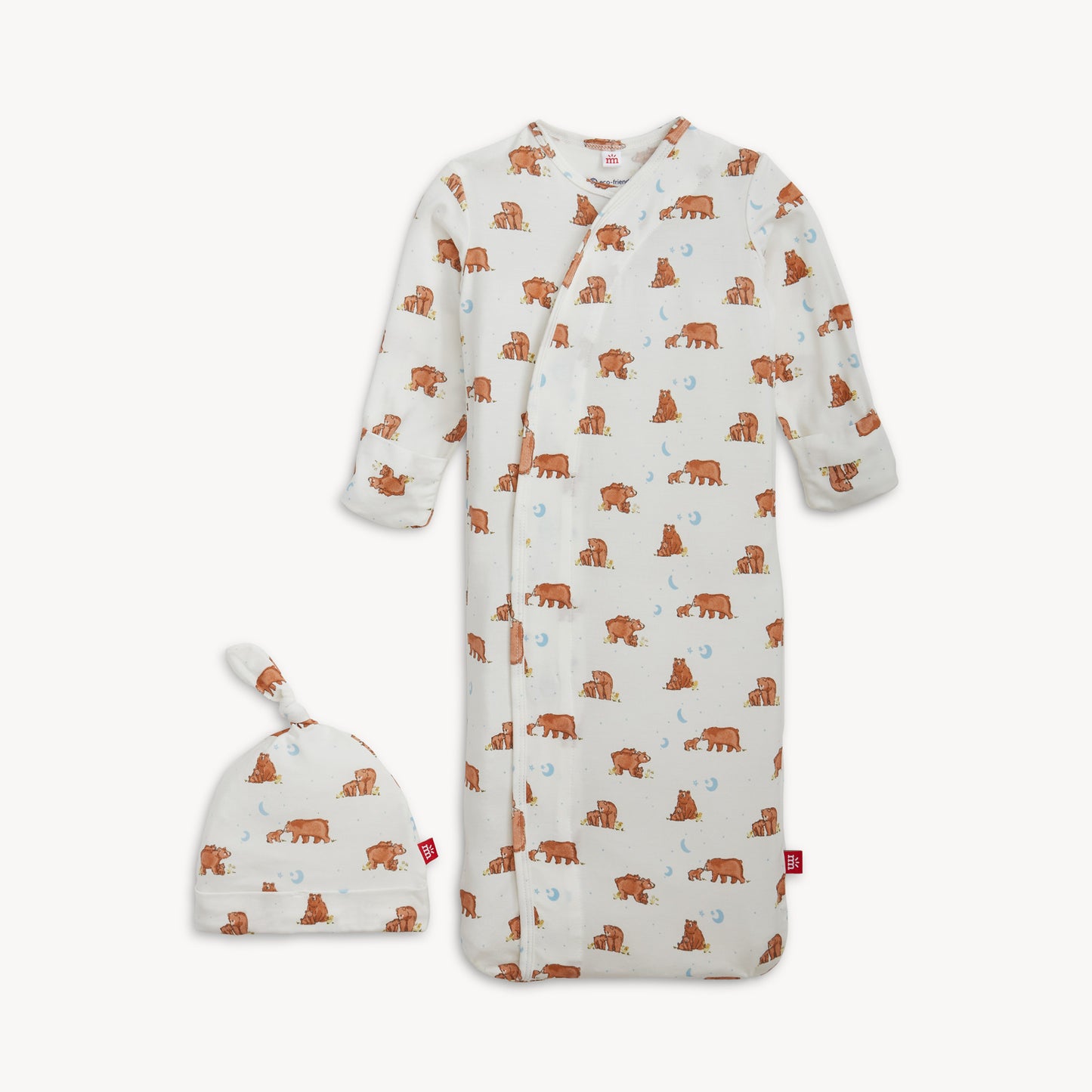Baby onesie with bear pattern and matching hat on a white background
