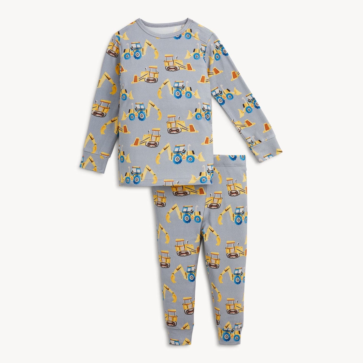 A two-piece children's pajama set featuring a light gray long-sleeve top and matching pants, both printed with a repeating pattern of yellow construction vehicles like tractors and excavators.