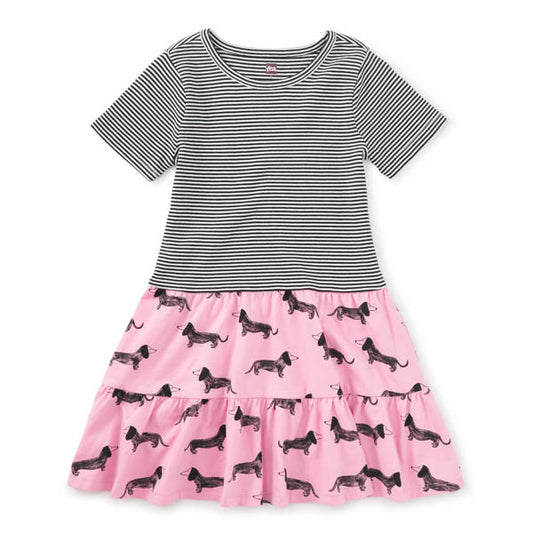 Short sleeve dress with black and white stripe on the top and pink skirt with dog pattern
