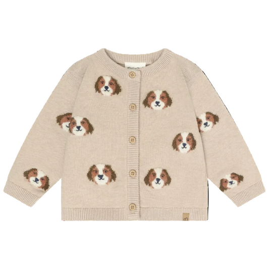 Beige cardigan with dog face patterns on a white background