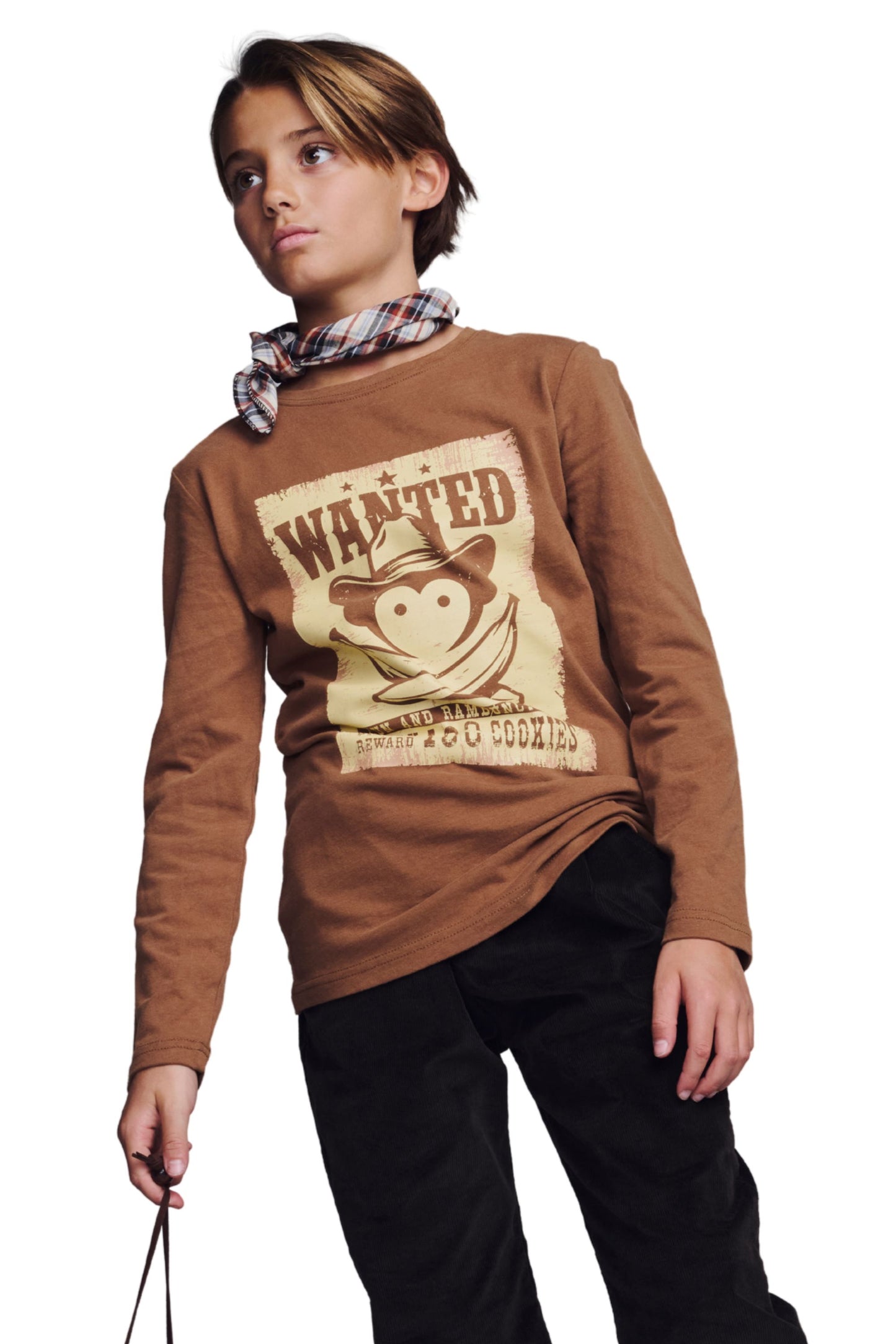 Boy wearing mocha graphic long sleeve tee with western Wanted poster design