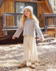 Child playing outdoors wearing the Wildflower Luna Top