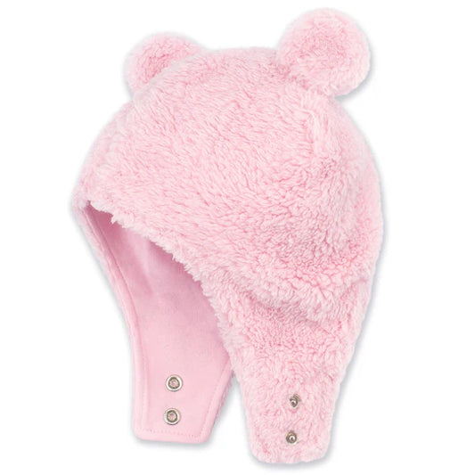 Pink fuzzy hat with a pom-pom on a white background
