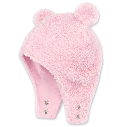 Pink fuzzy hat with a pom-pom on a white background