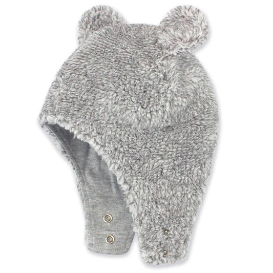 Gray fuzzy hat with earflaps and pom-poms on a white background