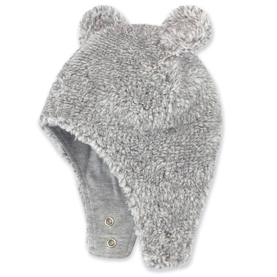 Gray fuzzy hat with earflaps and pom-poms on a white background
